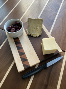 2ifbysea cheeseboard with cheese on it